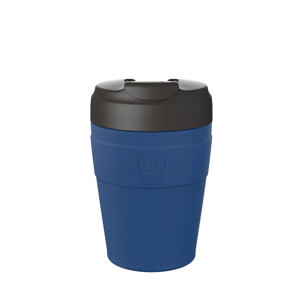 Blue reusable coffee cup with black lid and spill-proof opening, KeepCup brand logo visible on side