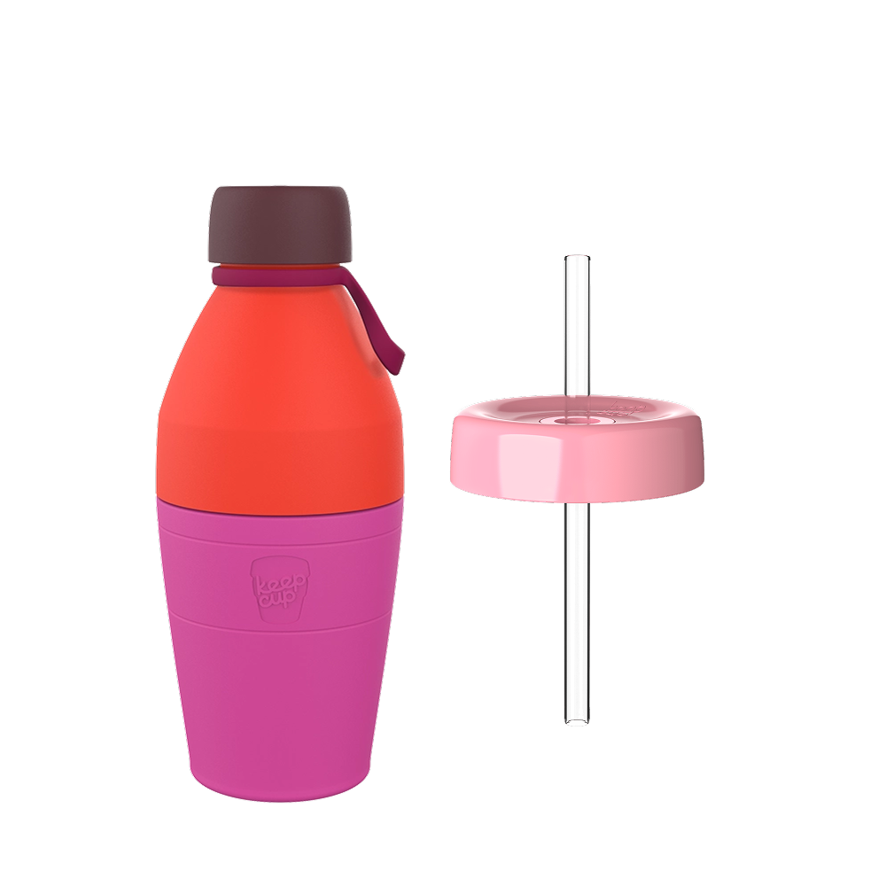 KeepCup Helix Bundle in Peony featuring a medium 18oz reusable bottle with coral orange upper body, pink silicone base sleeve, dark burgundy cap with carrying loop, displayed alongside a matching pink straw lid with clear plastic straw.