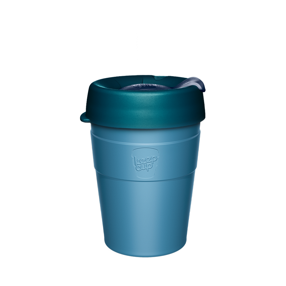 Teal KeepCup reusable coffee cup with matching lid and silicone grip band on white background