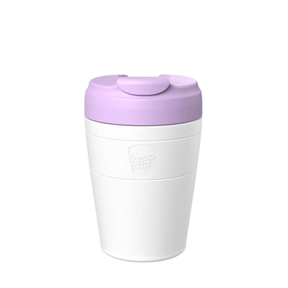 KeepCup Commuter M 12oz in White Lilac, featuring a white reusable cup  with a orchid lid and flip-top closure, shown in a front-facing product shot against a neutral background.