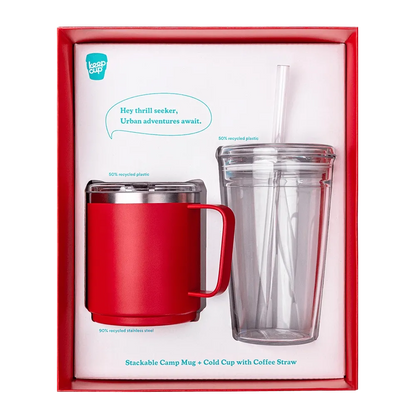 KeepCup Urban Adventurer gift set in Poppy, featuring a red stainless steel stackable camp mug and a clear double-walled cold cup with straw, displayed in red presentation packaging with product callouts noting recycled materials.
