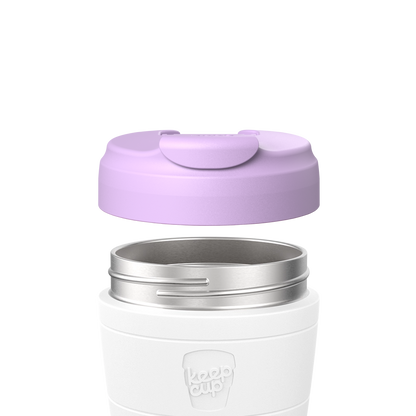 KeepCup Commuter Flip Lid in Wisteria shown lifted above a white KeepCup body with stainless steel rim, demonstrating how the lavender-colored lid attaches to the cup.