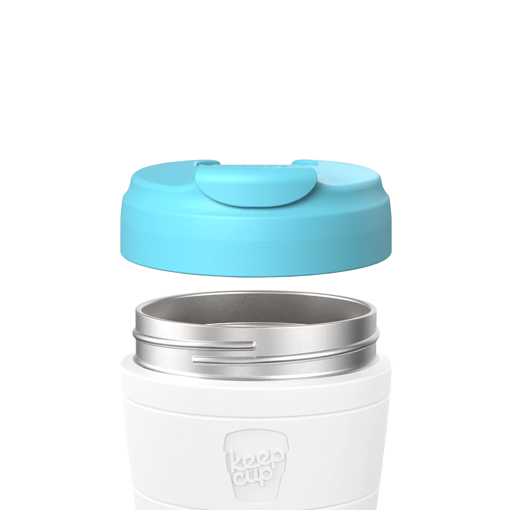 KeepCup Commuter Flip Lid in Cloud blue shown separated from a white reusable cup, displaying the stainless steel rim and flip-top closure mechanism in an exploded product view.