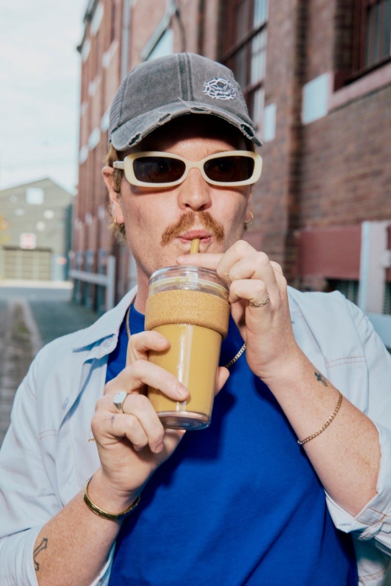 Man holding KeepCup Cold Cup Cork in 16oz with iced coffee