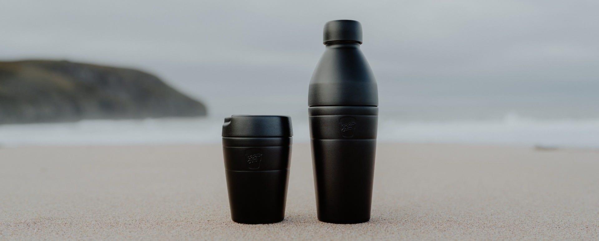 Woman holding KeepCup Traveller Bundle 16oz